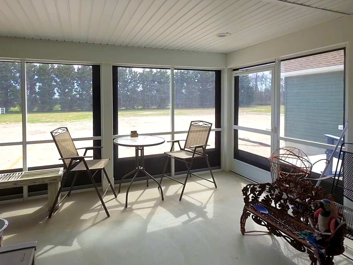 interior enclosed porch with clear vinyl panels
