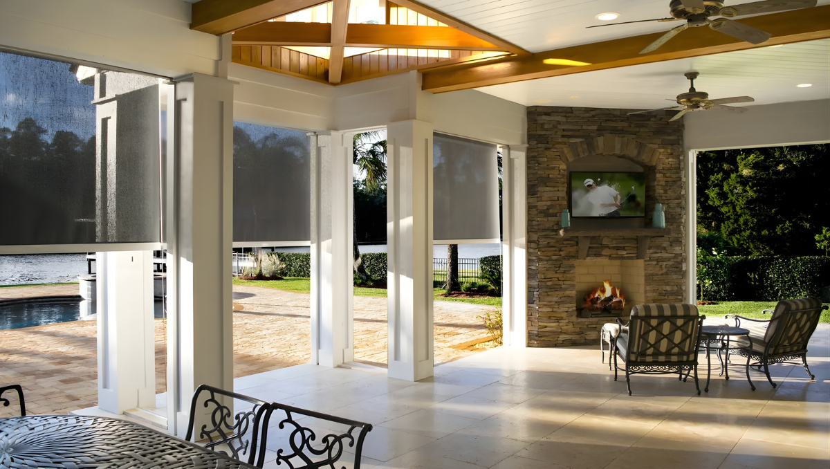 covered patio with motorized screens creating a cooler shaded outdoor seating area