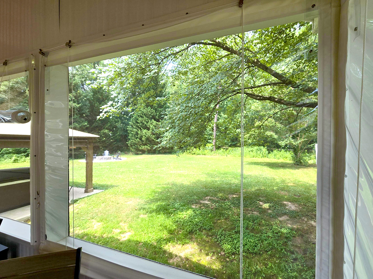 Inside Mounted Manual Roll-up Vinyl Porch Enclosure in Lewes, DE.